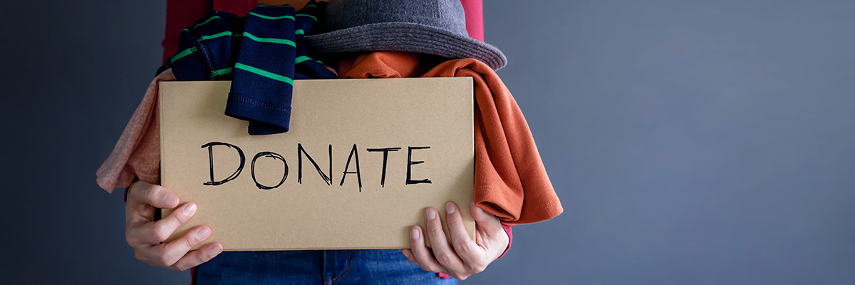 woman donates clothes to charity