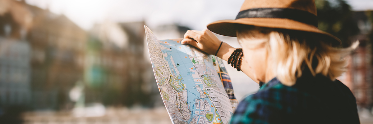 child reads map of park city utah