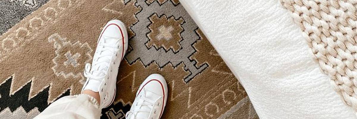 White sneakers on rug carpet