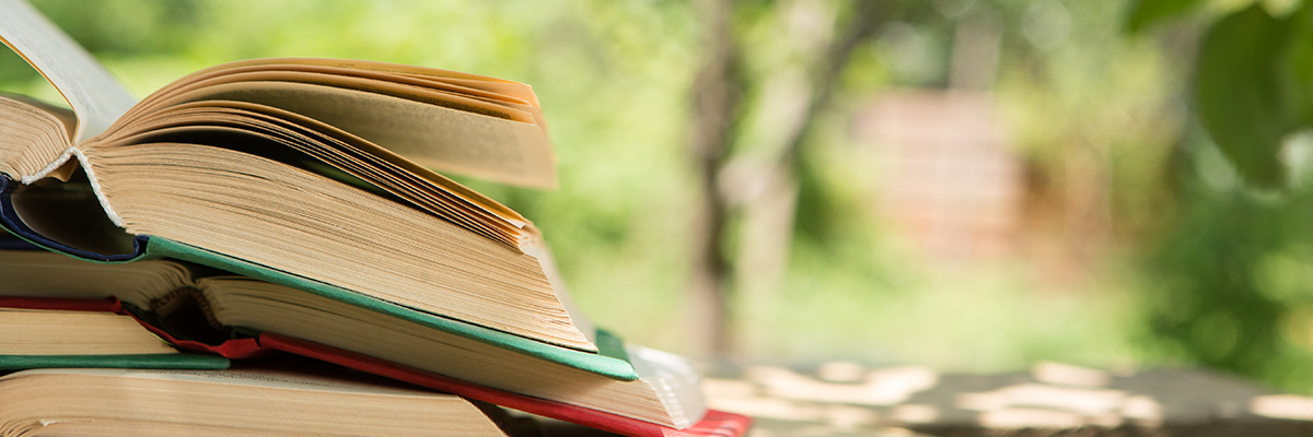 Stack of books on outdoor table
