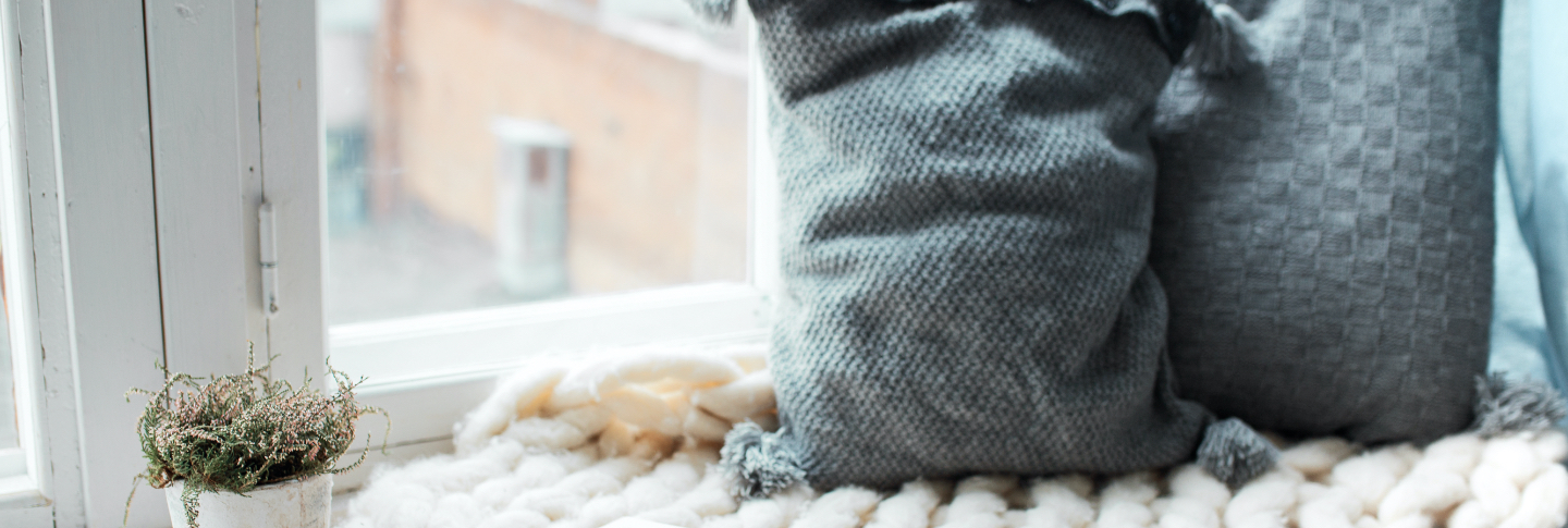Pillows next to a window