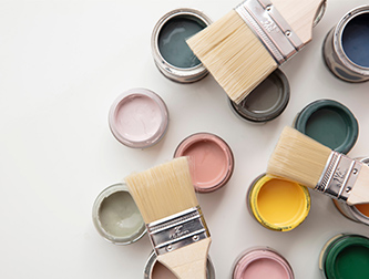 Brushes with open paint cans