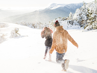 Winter couple playing in snow